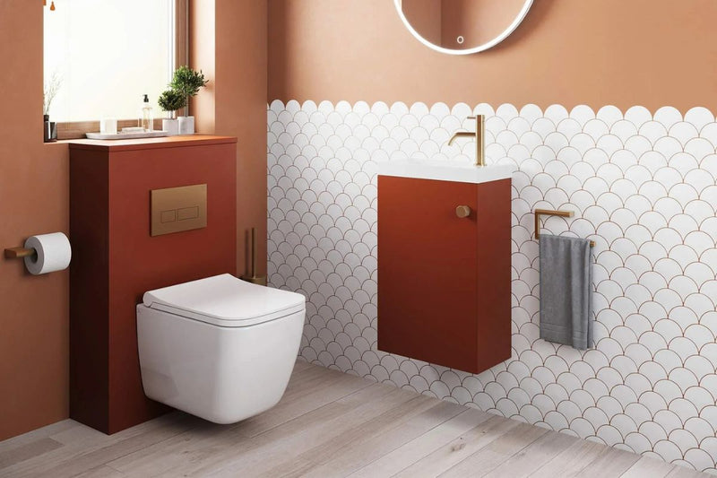 Orange wall hung cloakroom vanity unit in a small modern bathroom