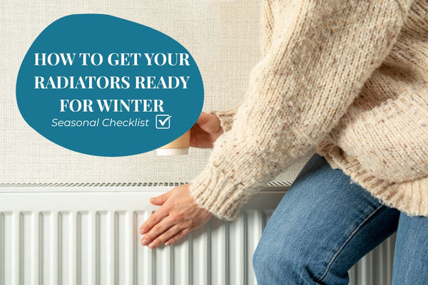 Woman checking the warmth of a radiator